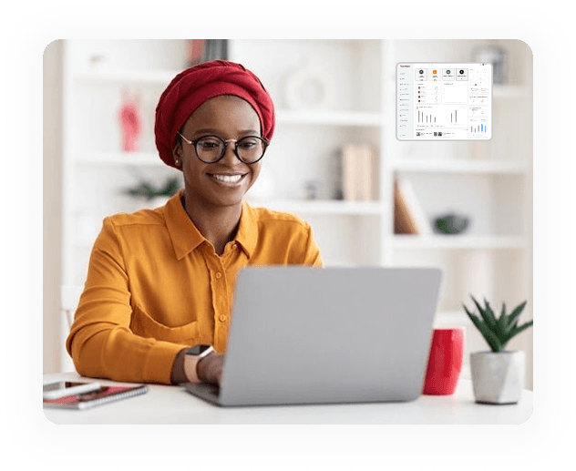 Smiling person using a laptop